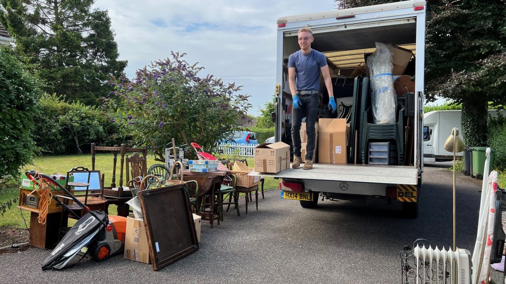 Team member separating furniture for donating to charity in Newbury
